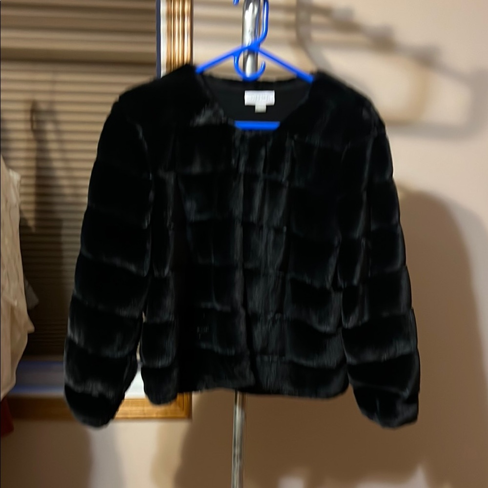 Faux fur jacket. I wore it once for a wedding